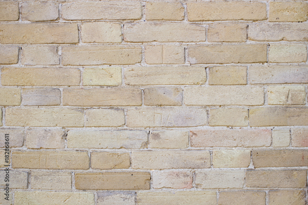 Yellow old brick wall background