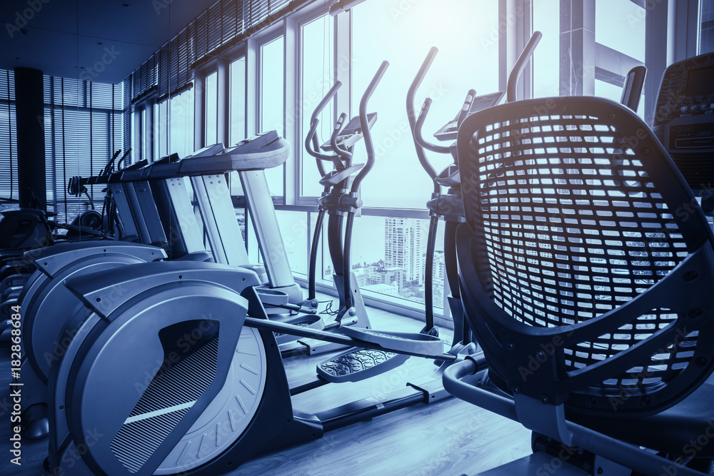 Elliptical in Fitness hall with the sport bikes in it health concept Elliptical in Fitness hall with the sport bikes in it health concept