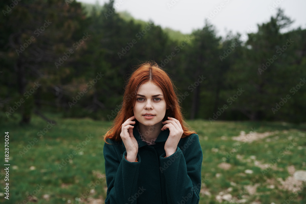 Beautiful young woman is walking in nature, in the forest, field Beautiful young woman is walking in nature, in the forest, field