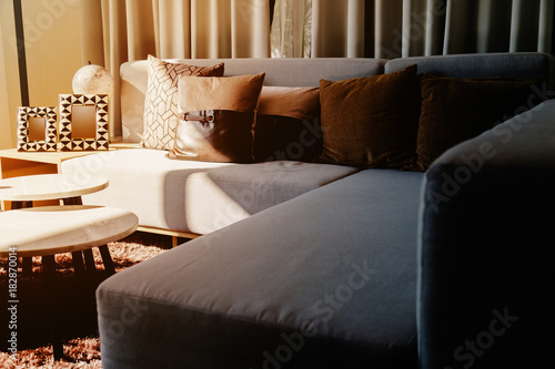 contemporary interior of Living room with part of sofa in sunny day and white curtain interior background concept