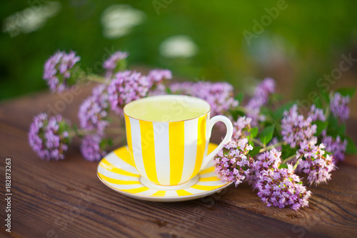 delicious oregano tea in a beautiful glass bowl on table