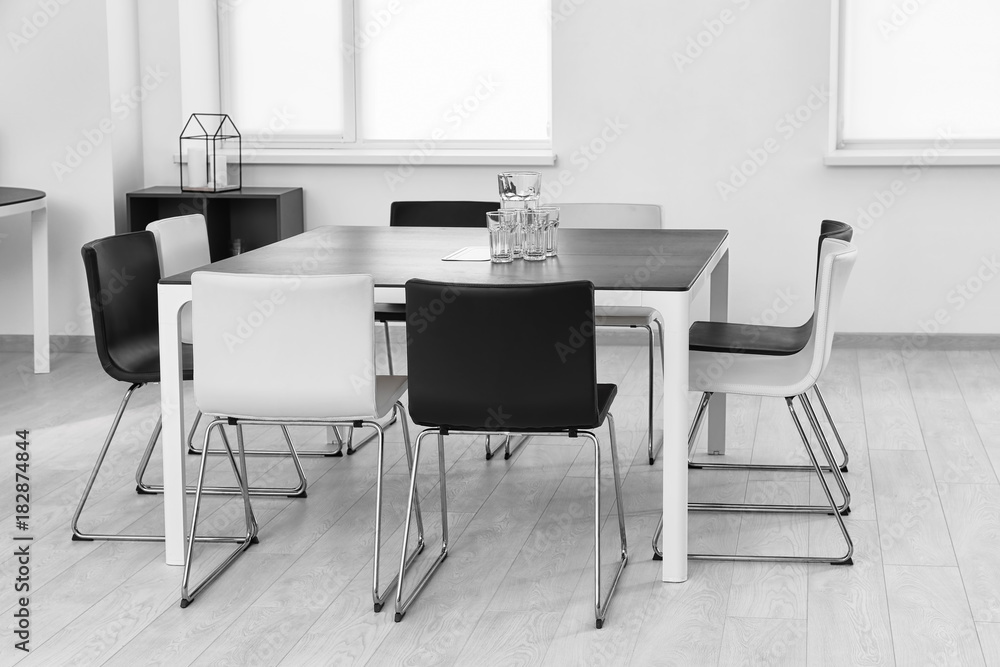 Modern room interior with big table and chairs Modern room interior with big table and chairs