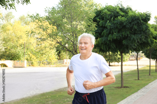 Mature man training outdoors