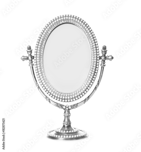 Vintage small mirror on white background