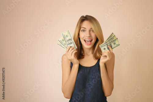 Happy young woman with doll...