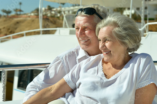 Elderly couple resting on yacht