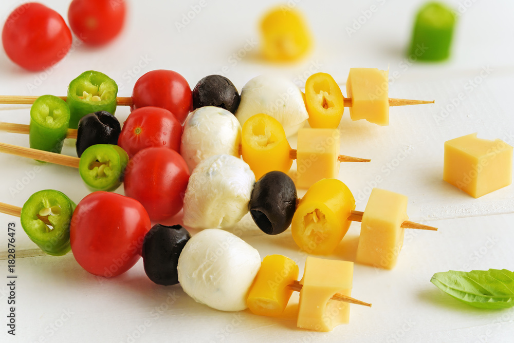 Appetizer on stick with various vegetables and cheese. Appetizer on stick with various vegetables and cheese.