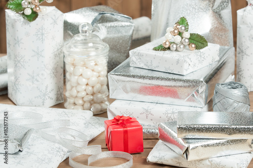 Group Of Wrapped Christmas Gifts  Silver Wrapping Paper  Decorations.