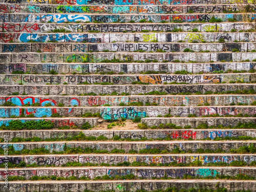 Photography fron view of stairs with graffiti