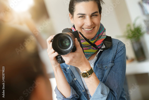 Portrait of woman photographer on a shooting day