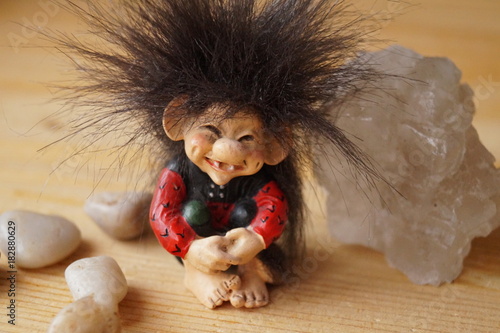 Slika na platnu A troll cute with a salt crystal and stones