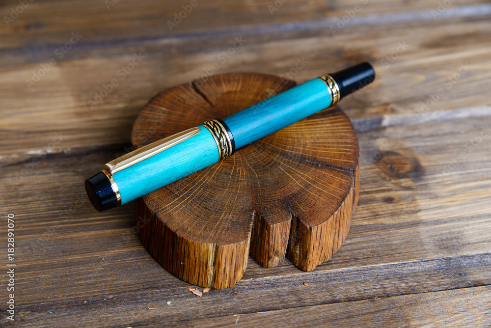 wooden writing pen on a wooden table