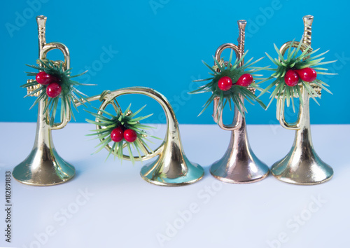 Three trumpets nad horn on the blue background