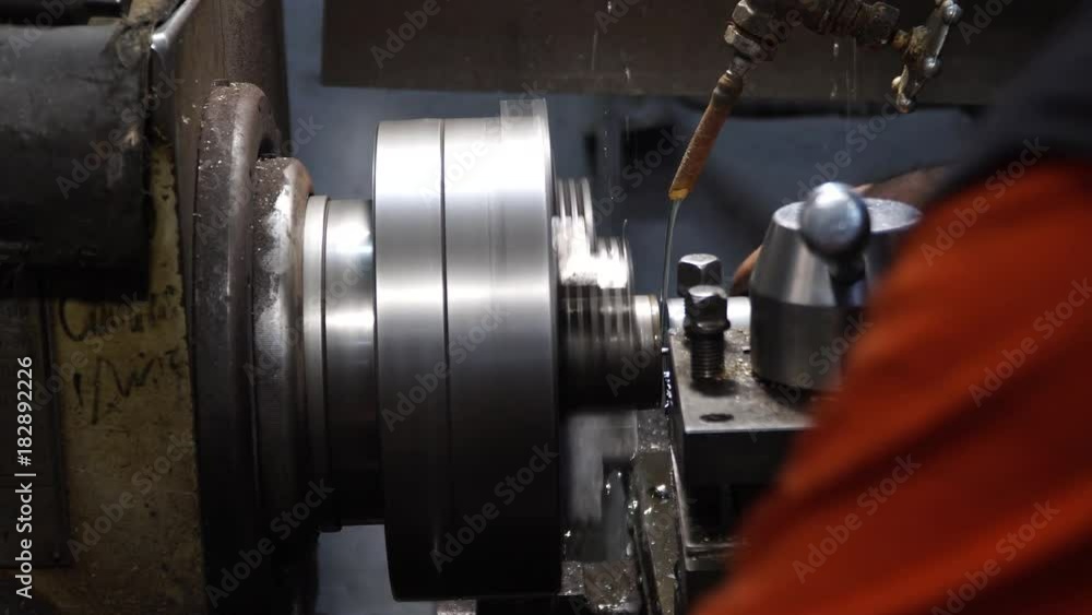 Turner is working on the machine. metal processing. worker works on a lathe. Turner running on the machine. Turning work. metal processing. Turner is working on the machine. metal processing. worker works on a lathe. Turner running on the machine. Turning work. metal processing.