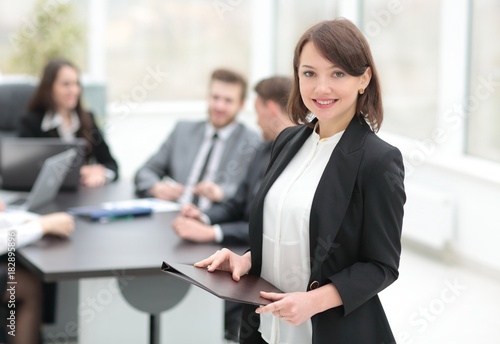 confident young business woman with documents