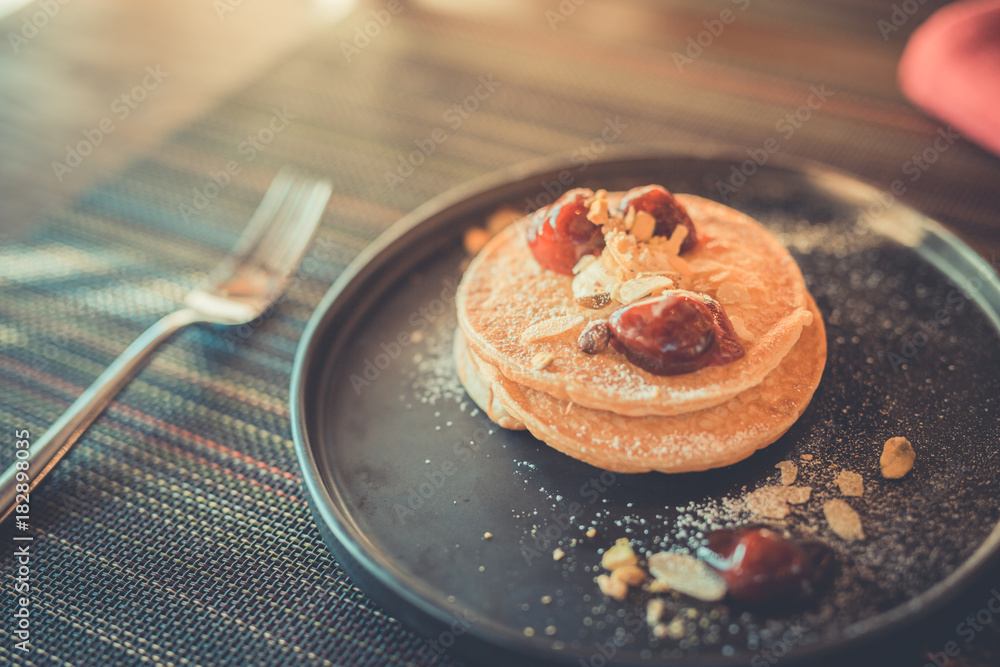 Morning table setup with pancakes and fruits Morning table setup with pancakes and fruits