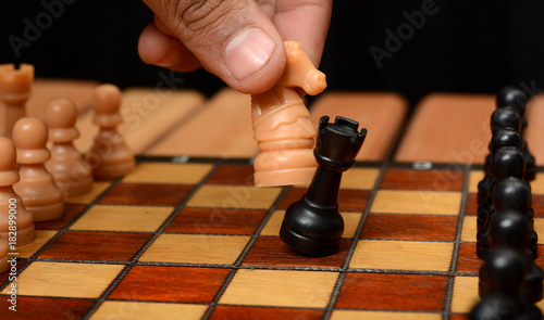 Checkmate playing concept with chessboard pawns and knight