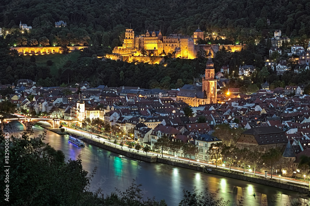 Heidelberg, Germany. Evening view of Old Town with Heidelberg Castle, Church of the Holy Spirit and Old Bridge (Karl Theodor Bridge) over the Neckar River.