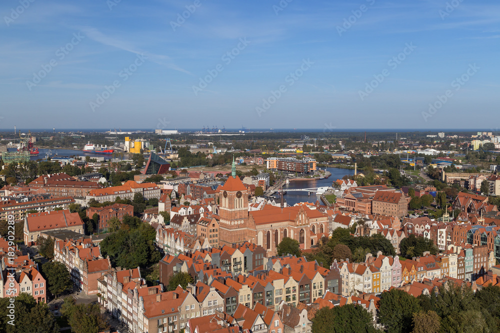 Old residential buildings and St. John's Church at the Main Town (Old Town) in Gdansk, Poland, viewed from above on a sunny day.