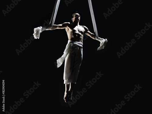 Male Aerialist performing Iron Cross