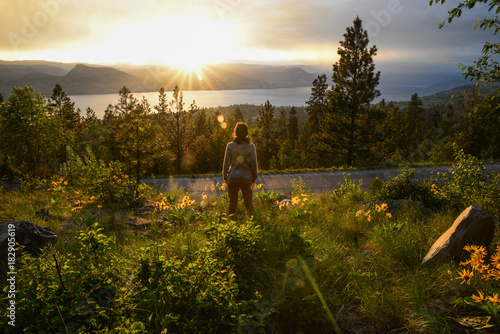 Girl enjoying the Sunset overlooking the okanagan lake in Penticton british columbia Canada