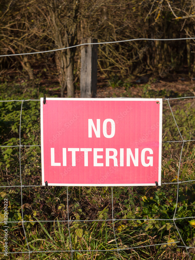 Fototapeta premium close up of red and white country sign no littering