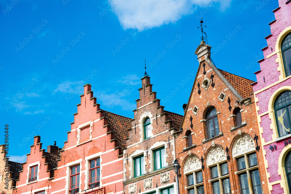 Colorful old brick houses in the Market Square in Old Town of Bruges, Belgium