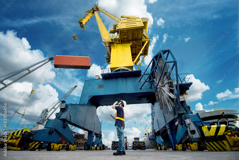 the port industrial gantry crane working under command of the loading ...