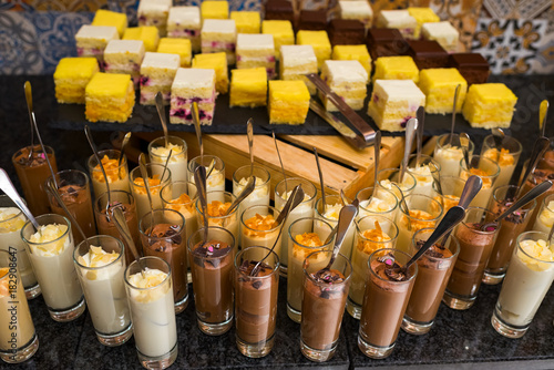 Chocolate mousse with cream, Orange Mousse, curd mousse on the candy bar