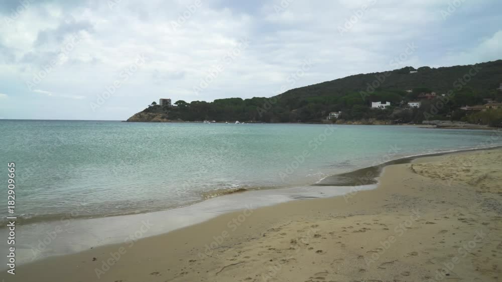 Empty beach and beautiful calm sea on cloudy day Empty beach and beautiful calm sea on cloudy day