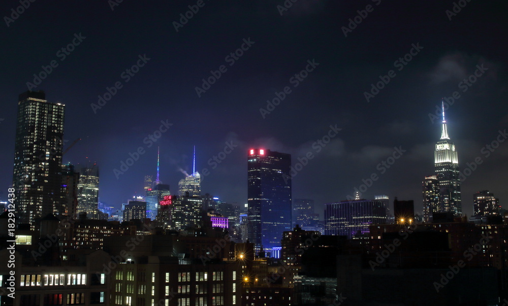 Night view of Manhattan skyline taken from a rooftop placed in the south-western corner of the island.