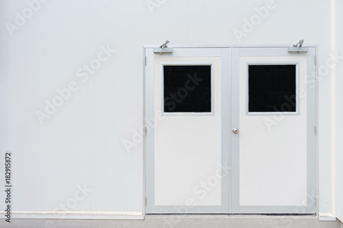 Double door in control room for pharmaceutical or food industry and concrete floor