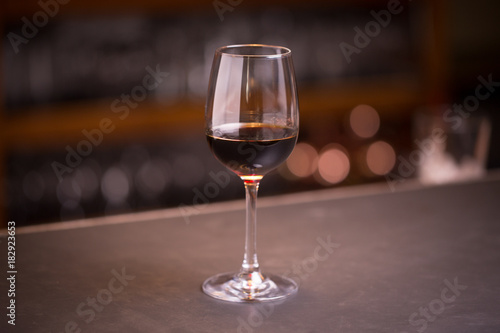 Glass of red wine at a bar