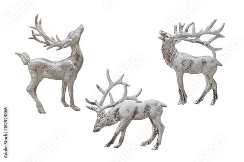 Christmas and New Year decorations: figurines of a reindeer. Isolated, white background. © iryna_l