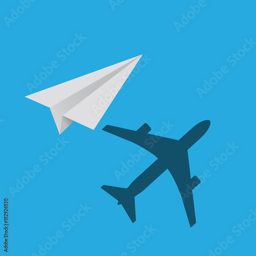 paper plane with real plane shadow on blue background