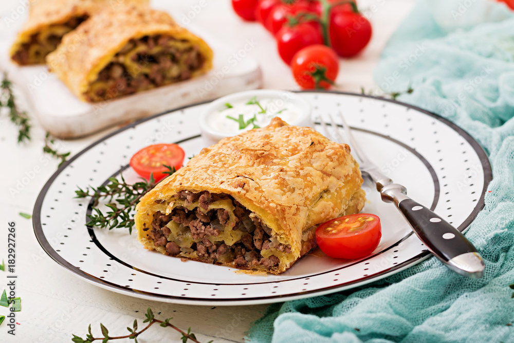 Appetizing strudel with minced beef, onions and herbs Appetizing strudel with minced beef, onions and herbs