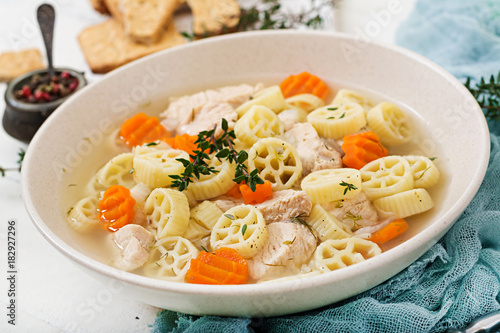 Dietary soup with turkey or chicken fillet with pasta Ruote and herbs photo