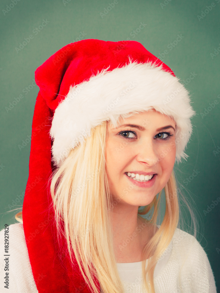 Happy young woman wearing Santa Claus hat Happy young woman wearing Santa Claus hat