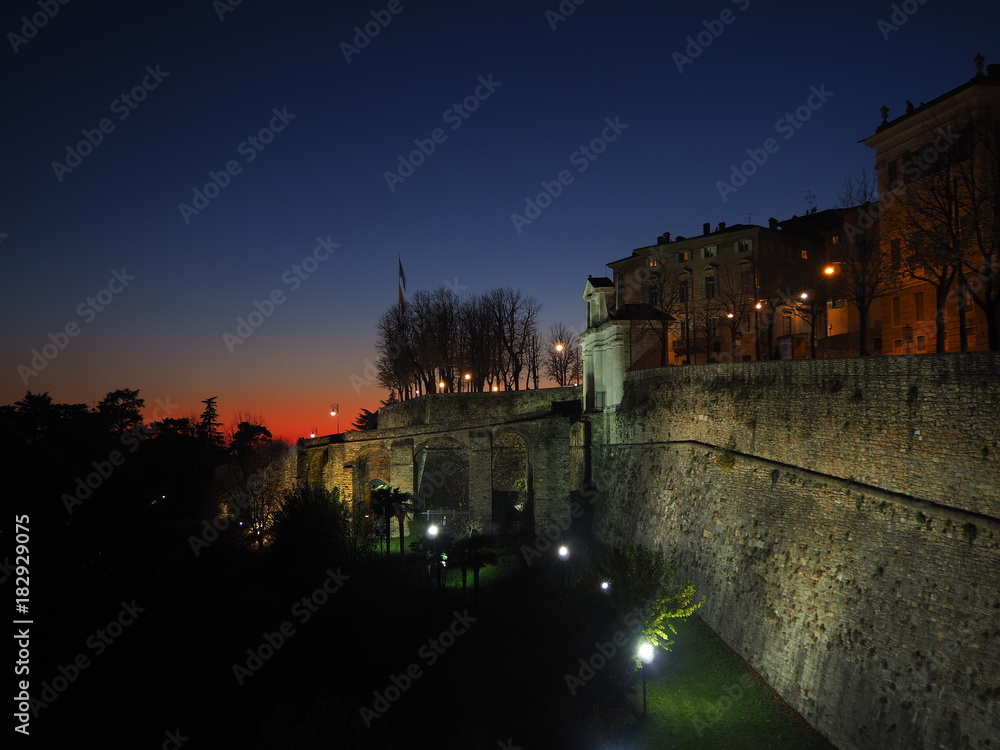 Bergamo, old city. Italy. Fiery sunset from the Venetian walls