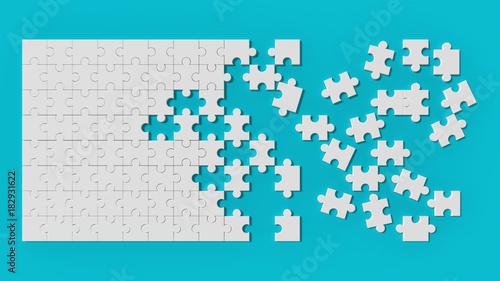 Photography White jigsaw puzzle with unsolved pieces on blue background