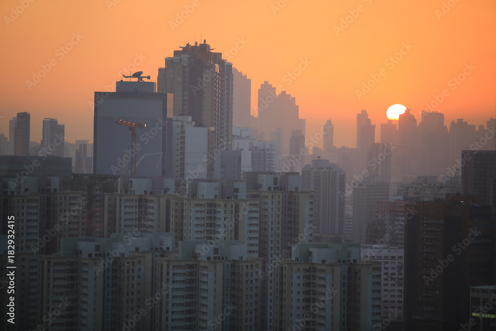 horizon sunset in hong kong with housing background