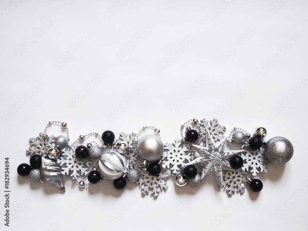 Christmas decoration with balls and snowflakes. View from above. Colors are black, gray, silver and white. New Year. Christmas decoration with balls and snowflakes. View from above. Colors are black, gray, silver and white. New Year.