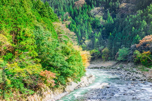 Beautiful mountain landscape and Hozu River seen from Sagano Scenic Railway or romantic train in Arashiyama  Japan.  Landscape and nature concepts.