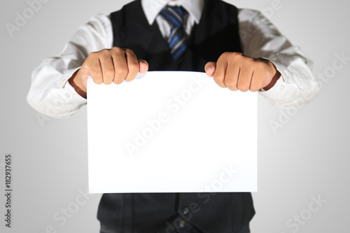 businessman holding blank paper template