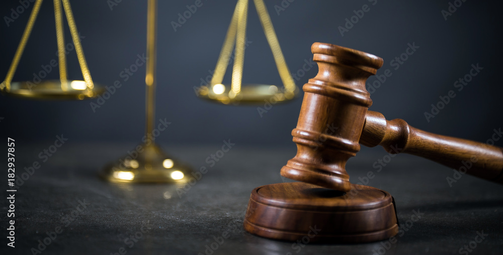Golden scales of justice, gavel and books on brown background, Law code Golden scales of justice, gavel and books on brown background, Law code