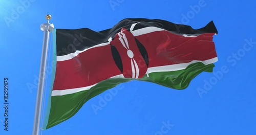 Flag of Kenya waving at wind in slow with blue sky, loop photo