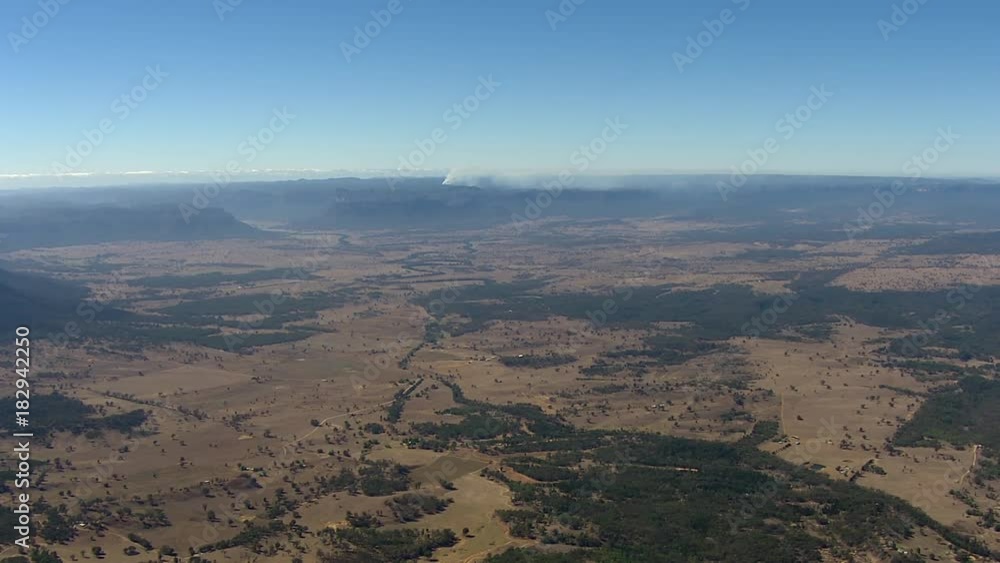 A birds eye view shot of mountains and trees. Camera moves forward A birds eye view shot of mountains and trees. Camera moves forward