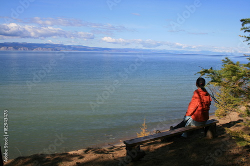 Woman looks at lake Baikal