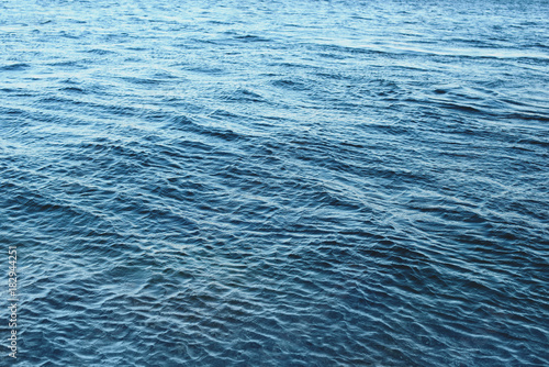 Blue ripples water in sea ocean. Surface of blue water in nature ocean. Textured background.