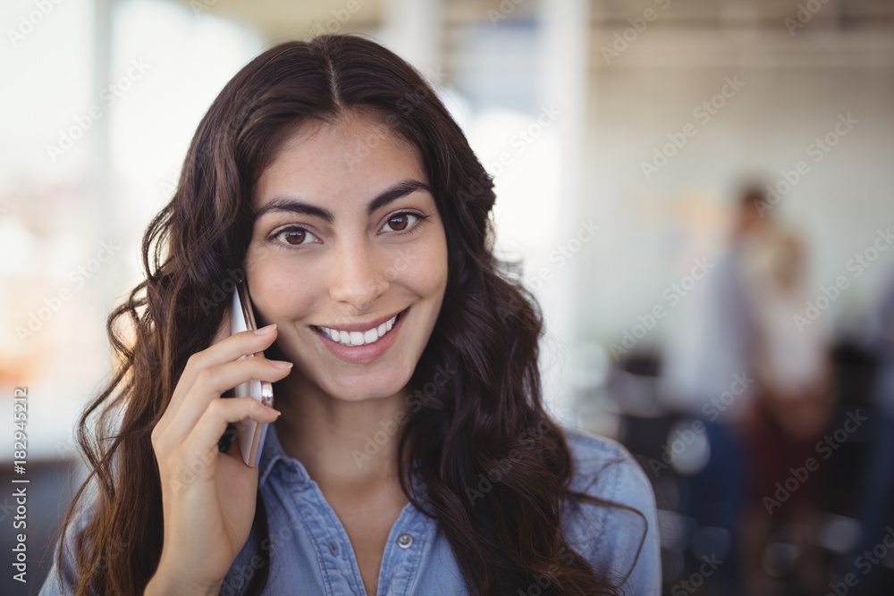 Portrait of pretty businesswoman talking on mobile phone Portrait of pretty businesswoman talking on mobile phone